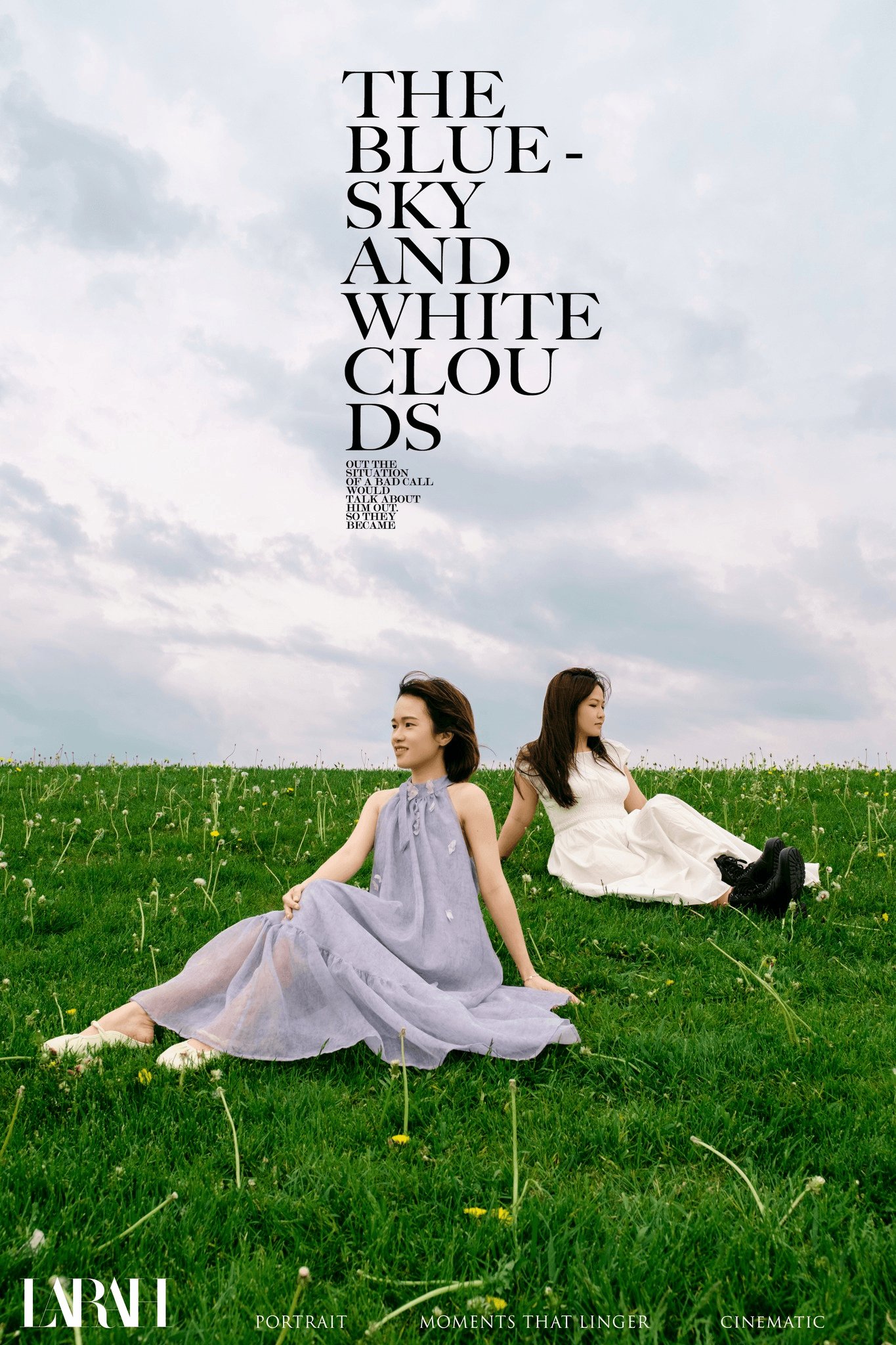 Two women seated in a green field below blue and white clouds